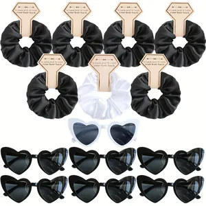 Detail of satin scrunchies and heart-shaped sunglasses set for bridesmaid wedding gifts