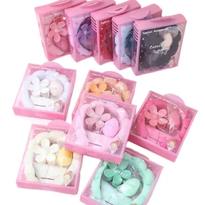 Set fascia in spugna con pinza per capelli a fiore e spugna trucco in confezione rosa