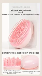 Detail of pink scalp massage brush with dual-length bristles for hair care