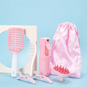 Pink 6-piece hair care set with spray bottle, brushes, clips and storage pouch