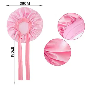 Pink satin bonnet detail showing 36cm diameter and 57cm adjustable long strap length