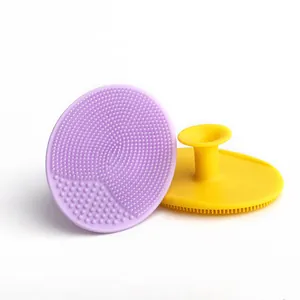Two-piece silicone baby bath brush set for cradle cap massage in purple and yellow
