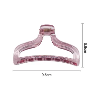 Translucent pink hair claw clip in 9.5cm length with durable gold metal spring
