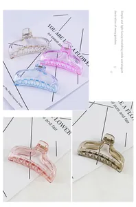 Close-up of translucent hollow geometric hair claws with gold metal spring accents