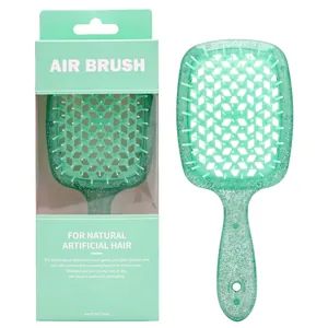 Dettaglio macro della spazzola glitter verde menta con design a nido d'ape e confezione