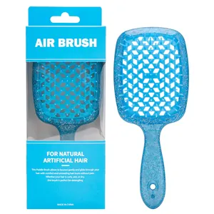 Dettaglio della spazzola blu brillante con design a nido d'ape nella confezione originale