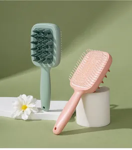 Dubbelzijdige hoofdhuid massageborstel met grove tanden en lang handvat in pastel