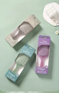 Macro view of vintage pattern on square cushion hairbrushes in green and purple
