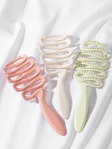 Set di 3 spazzole per capelli curve in rosa, crema e verde su raso bianco
