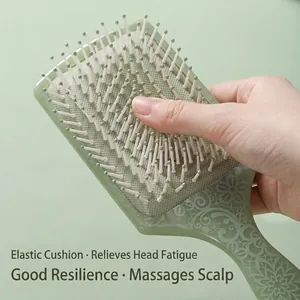 Pale green square air cushion hairbrush with floral patterns and massaging bristles