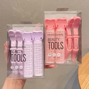Pink and purple hair roller set for volume and fringe styling with secure clips