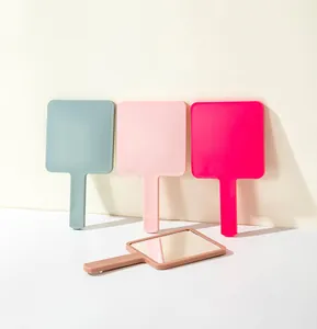 Detail showing square handheld mirrors in four matte colors with high definition reflection