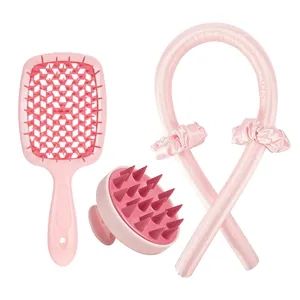 Pink hair care set with hollow vent brush, scalp massager, and silk heatless hair curler