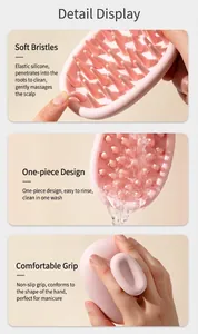 Detail of soft silicone bristles and ergonomic handle on pink scalp massager brush