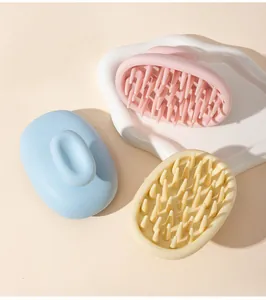 Detailed view of silicone scalp massagers with ergonomic handles in pastel colors