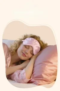 Pink faux silk sleep mask and pillowcase set for a comfortable nighttime routine