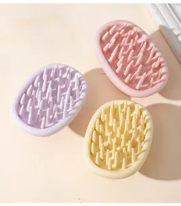 Three-piece silicone scalp massager brush set in lavender, pink, and beige pastel colors