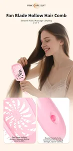 Pink hollow vented detangling hairbrush with ergonomic handle and massage bristles