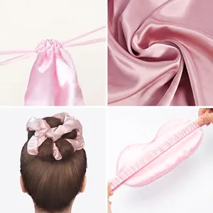 7-piece pink satin heatless hair curler set with sleeping mask, scrunchies, and storage bag