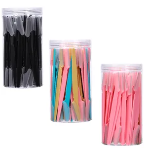 Detailed view of eyebrow razors in large capacity jars with transparent safety caps