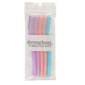 Set of multi-colored eyebrow and facial dermaplaner razors in transparent retail packaging