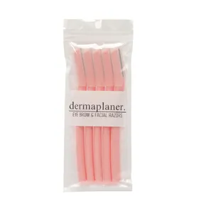 Five pink dermaplaning facial razors with protective caps in clear retail packaging