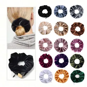Macro view of velvet hair scrunchies with hidden zipper pocket for storage