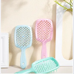 Hollow honeycomb hair brushes in pink, blue, and green for volumizing styling