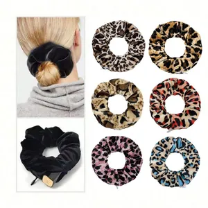 Close-up of velvet scrunchies with hidden zipper pocket for storage of small items