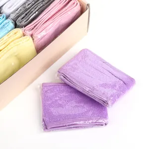 Detail of colorful microfiber headbands in individual packaging and storage box