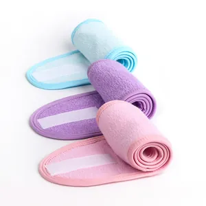 Detailed view of soft microfiber spa headbands with adjustable velcro straps in pastel colors