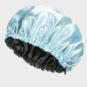 Detailed view of blue double-layered satin hair cap with elastic trim for hair protection
