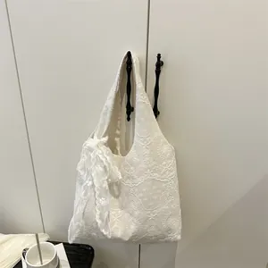 White floral lace tote bag with large embroidered ribbon bow in elegant Korean style