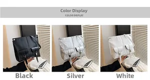 Trois grands sacs cabas en noir, argent et blanc avec poches avant et boucles en métal