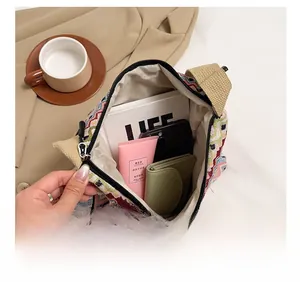 Interior view showing the large capacity and woven texture of the ethnic shoulder bag