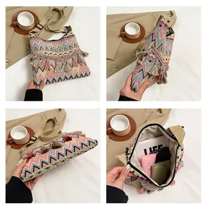 Detail view of ethnic style woven bag with colorful tassels and large capacity interior