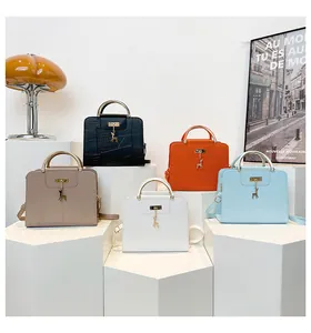 Collection of croc-embossed handbags in five colors featuring deer charms and metal handles