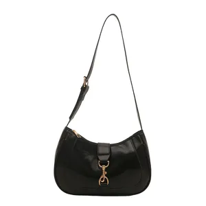 Glossy black hobo shoulder bag with gold lobster clasp hardware on a white background