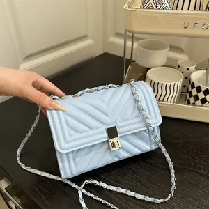 Chic light blue quilted chain shoulder bag with V-shaped stitching and silver metal lock