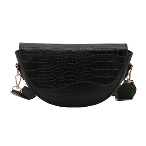 Women's black semi-circular saddle bag with crocodile texture and wide shoulder strap