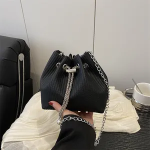 Fashionable black drawstring bucket bag with silver chain and pearl decoration