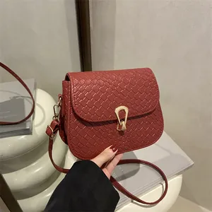 Elegant wine red woven leather crossbody bag with stylish gold horseshoe metal buckle