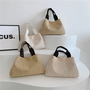 Minimalist straw woven tote bags in four neutral colors with thick fabric handles