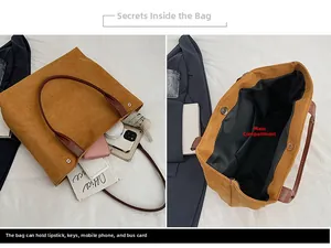 Detailed view of spacious brown suede tote bag interior with magnetic metal closure