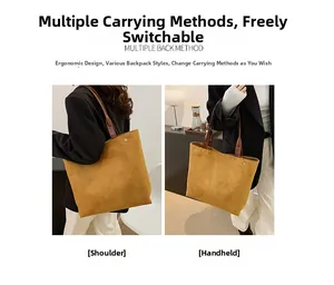 Detail view of ginger suede tote bag with brown leather handles and side metal buckles