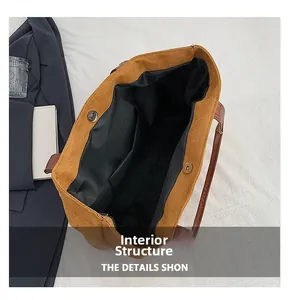 Internal structure of brown corduroy tote bag showing magnetic buckle and inner pocket