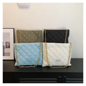 Detailed display of quilted chain bags in military green, black, blue, and white colors