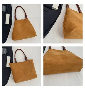 Detail showing the brown faux suede texture and leather handle with metal rivets