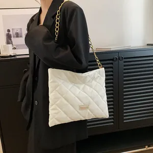 White quilted puffer shoulder bag with gold chain strap and stylish diamond pattern