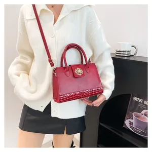Chic burgundy leather handbag with crocodile pattern and golden floral lock for women